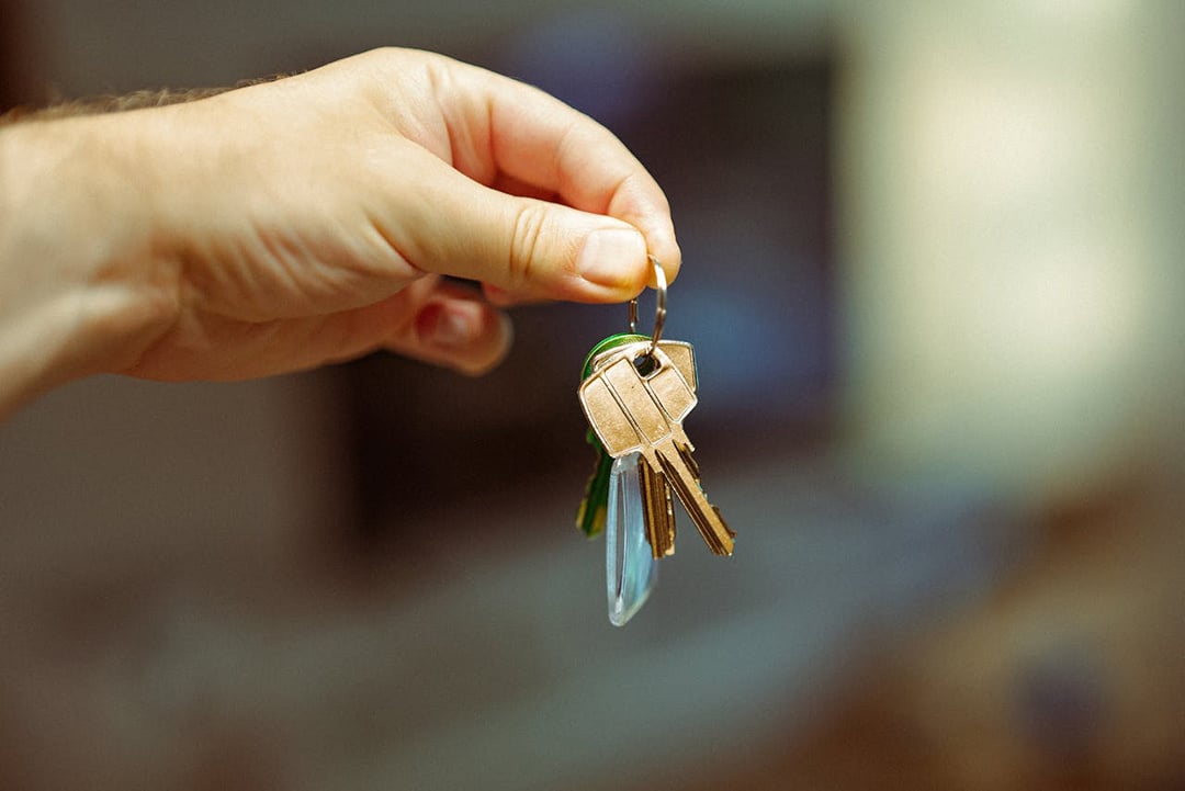 New homebuyer holding keys to new home