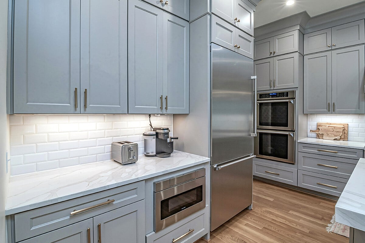 A kitchen in a newly constructed home with stainless steel appliances