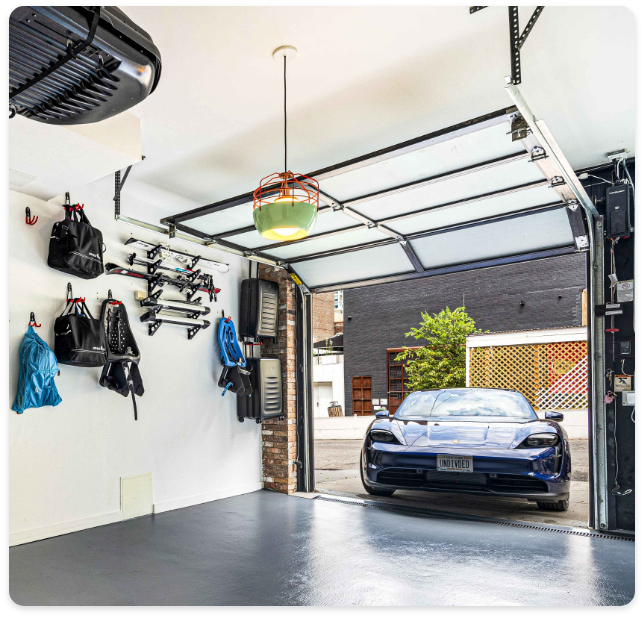 Luxury NYC garage featuring organized space and high-end vehicle showcasing premium real estate.