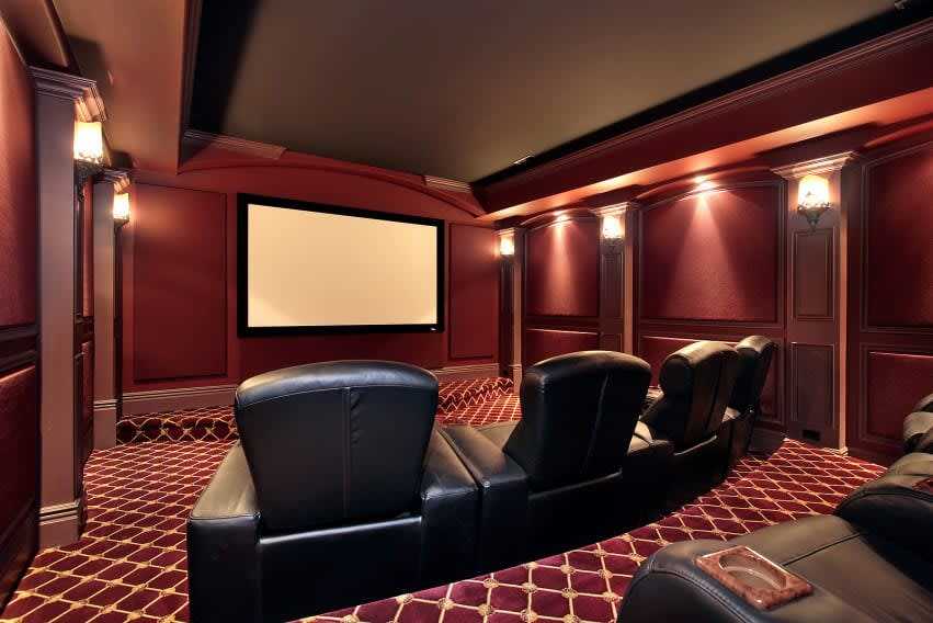 Luxury home theater setup showcasing high-end renovations that may not add resale value in NYC real estate.