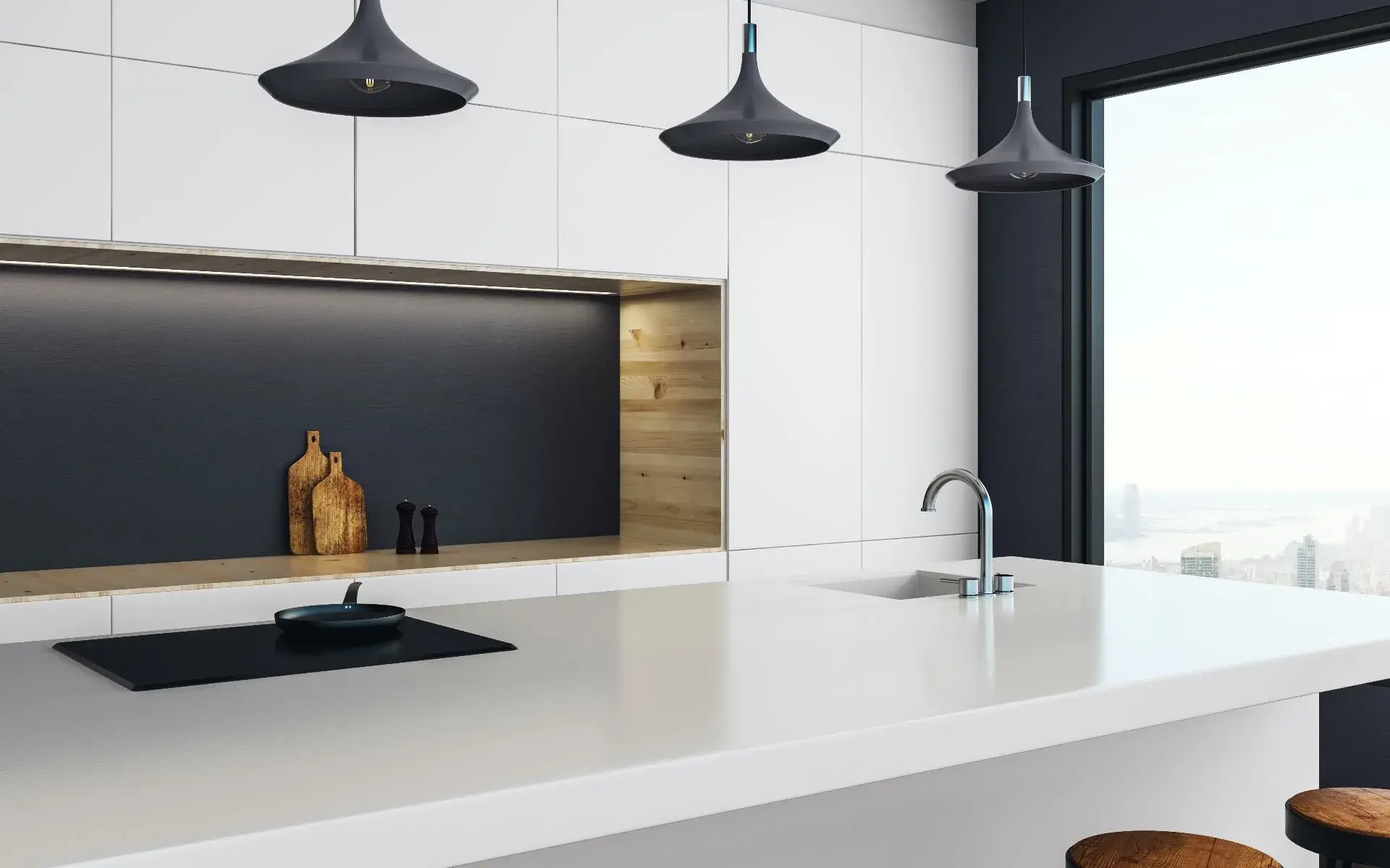 Sleek kitchen design featuring black pendant lights and a minimalist white island.