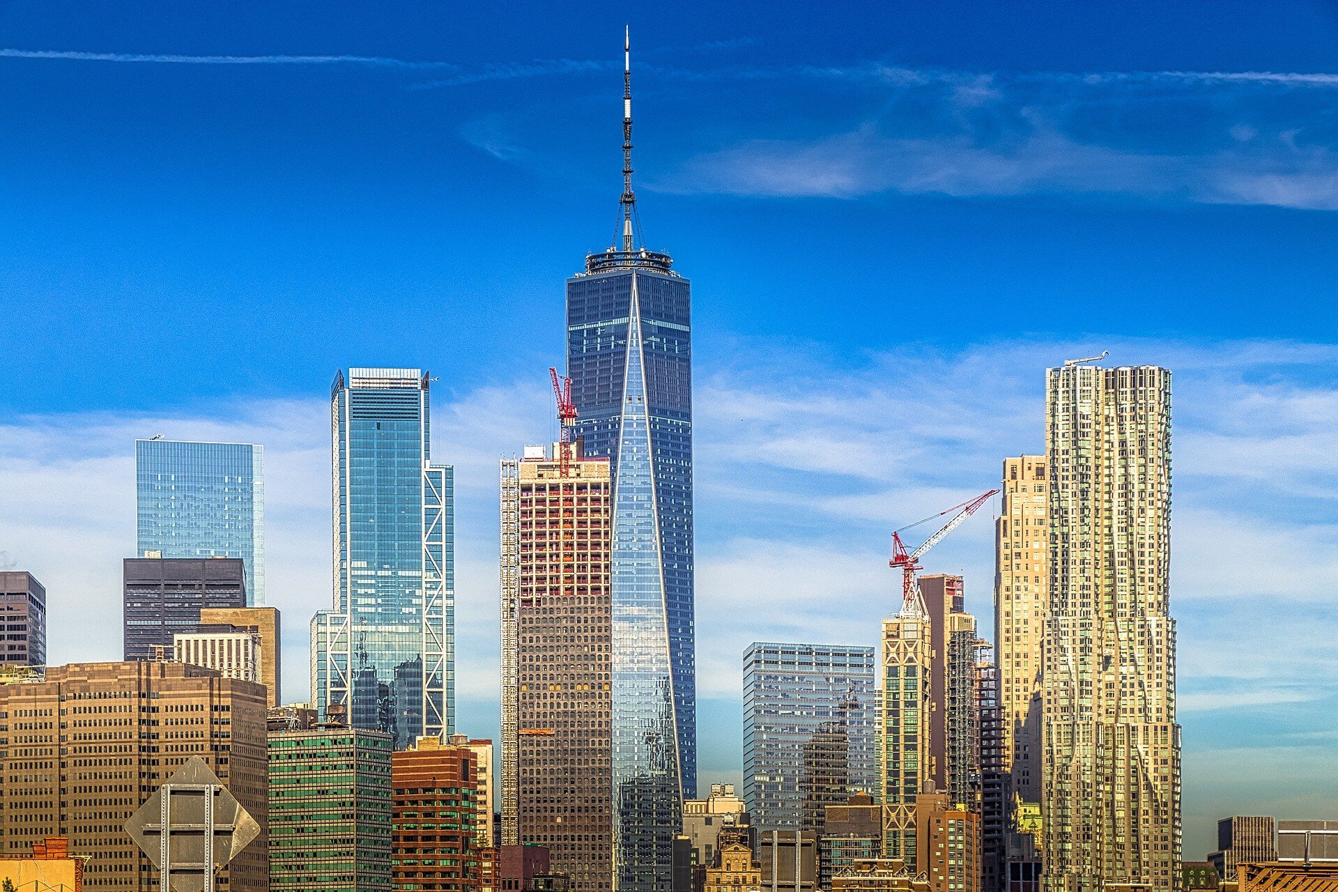 One World Trade Center skyline view with surrounding skyscrapers in New York City.