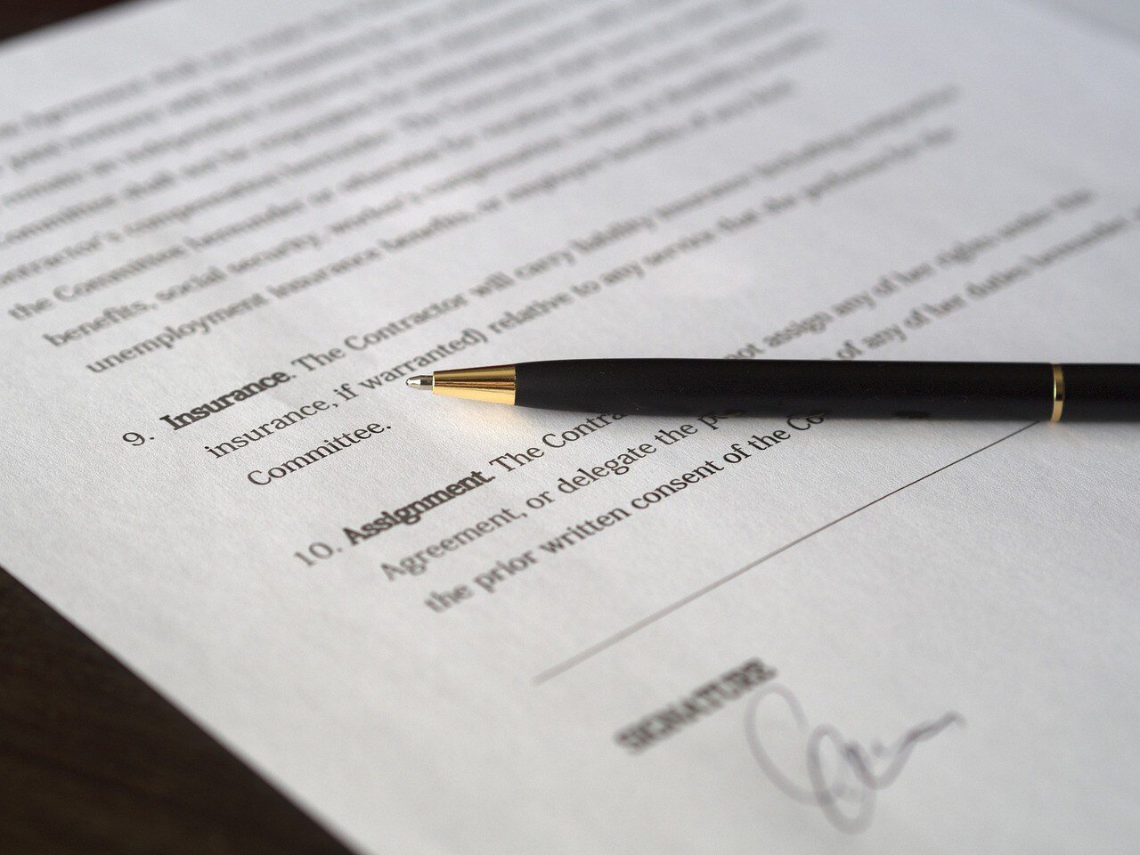 sales contract with a pen 