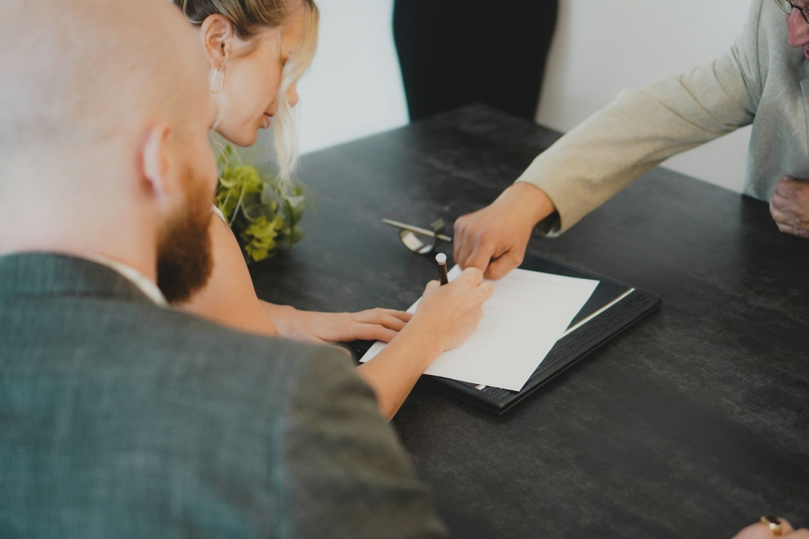 Couple signing documents