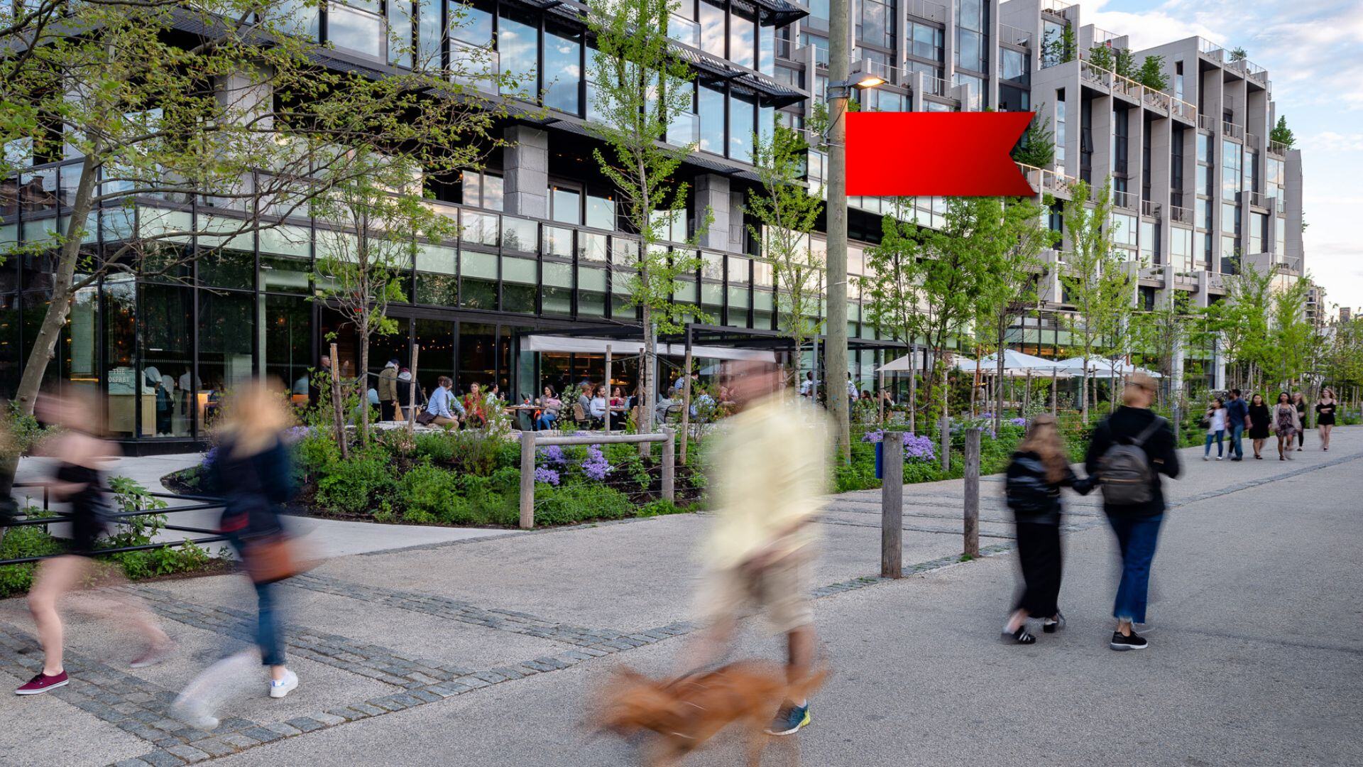 Vibrant NYC neighborhood with modern apartments, retail spaces, and walkability.