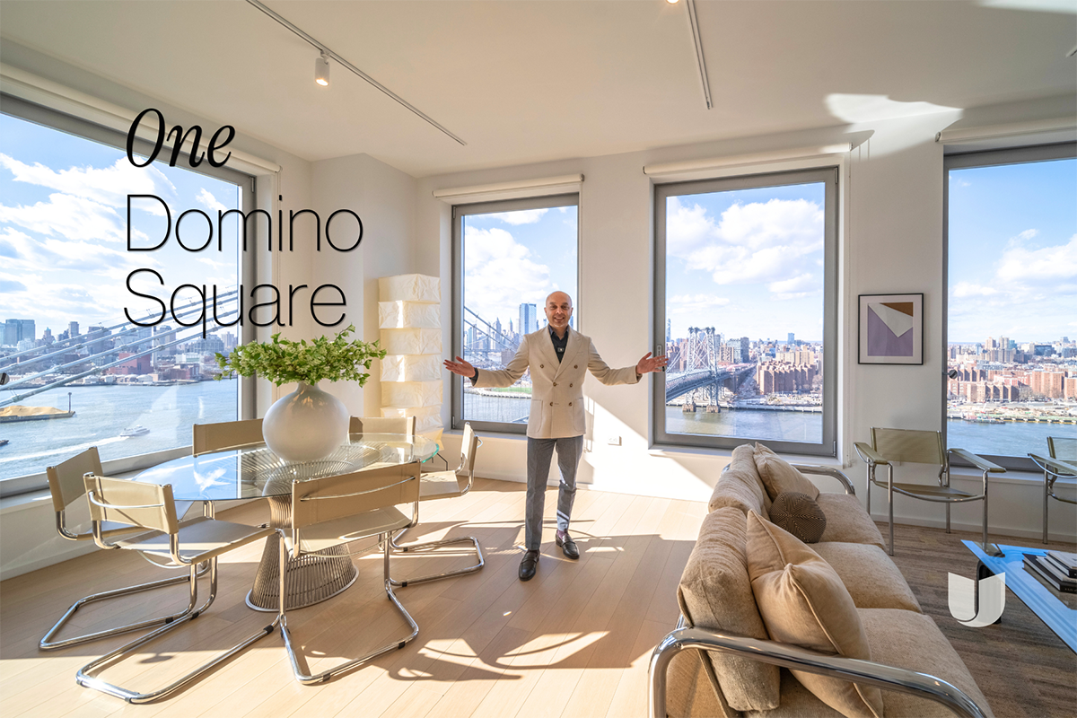 Mukul Lalchandani standing inside luxury condo at One Domino Square